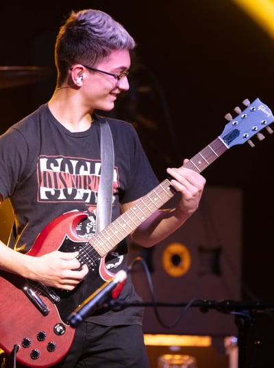 Gurnee Guitar Academy Guitar Lessons a man with a guitar and a guitar