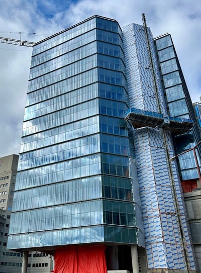 a building with a crane in the background