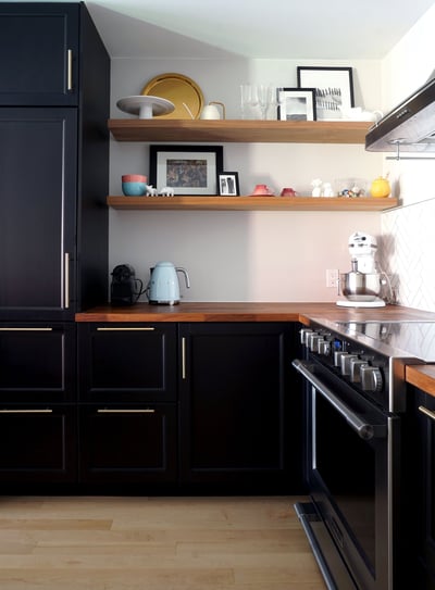 a kitchen with a stove and wood countertop