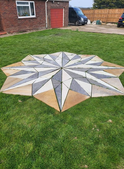 Sandstone mosaic being cut in ingham