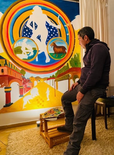 artist Yous contemplating his painting “Aquarius"