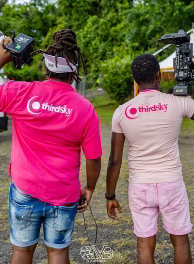 two men standing with camera