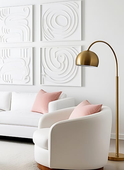 a living room with a couch and a curved floor  lamp