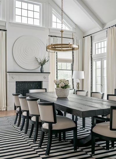 a dining room with a large table and chairs