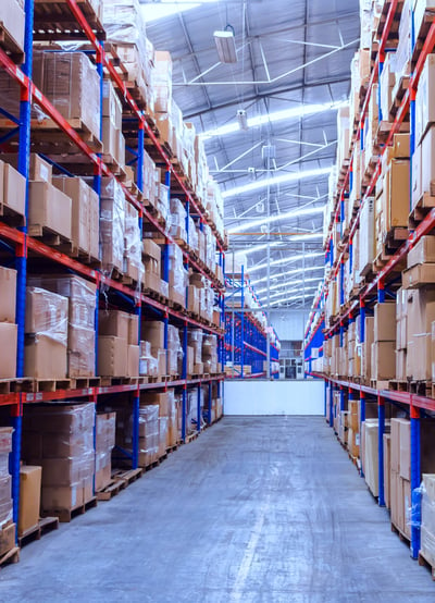 Narrow Aisle Pallet racking in warehouse storing boxes of goods