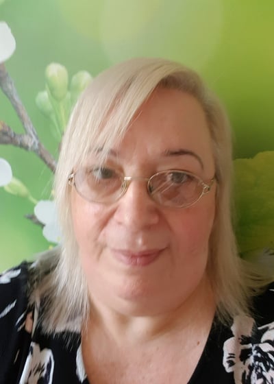 a picture of Kath. She has a kind face, white hair and glasses. She's lovely if I say so myself.