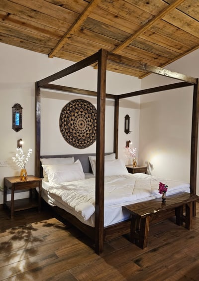 King bed with forest view at ilika Resorts, Uttarakhand