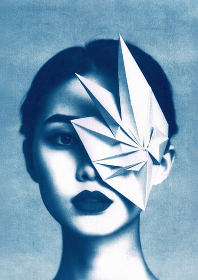 Close-up of a woman with blue-toned skin, dark lips, and a geometric paper structure covering her ri