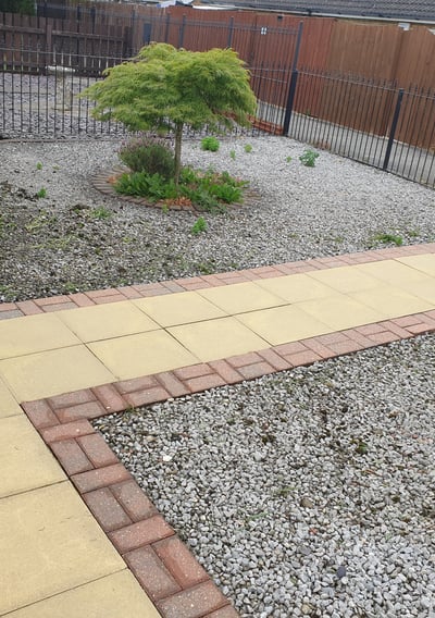 After photo of a patio and garden path in Hull, professionally jetwashed to restore a bright, fresh