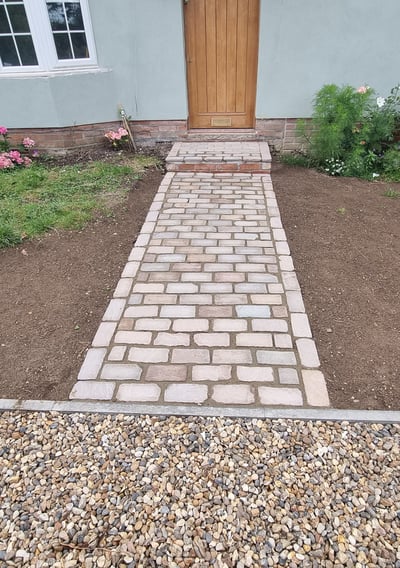 Cobbled pathway from natural stone sets 200mm X 100mm 