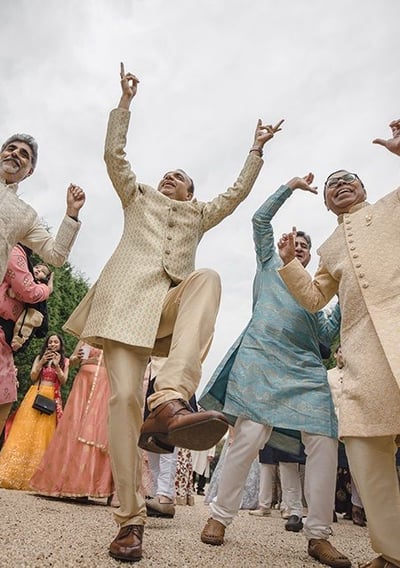 a group of men and women in traditional indian attire
