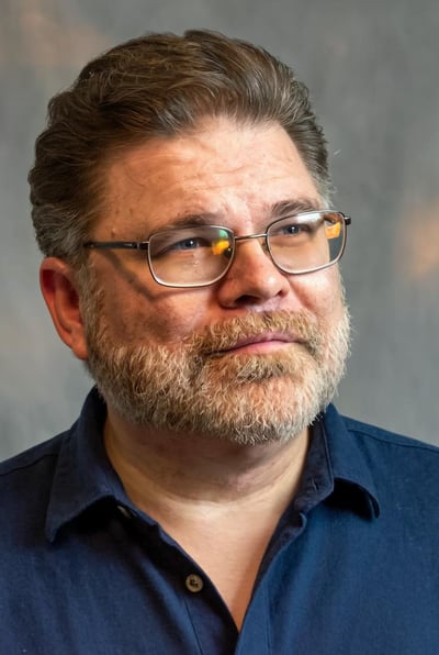 a high-resolution headshot of Justin Deane Hoke