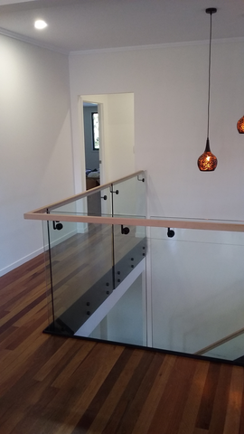 Glass balustrade with timber handrail 