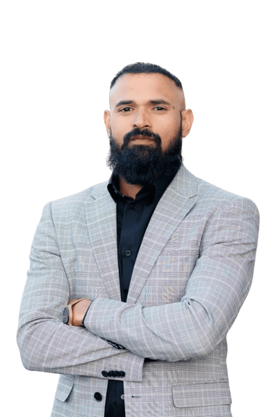 Albin Rappai in a grey suite and dark beard.