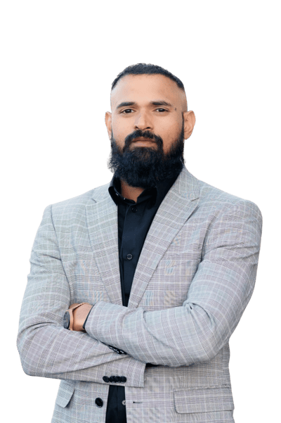 Albin Rappai in a grey suite and dark beard.