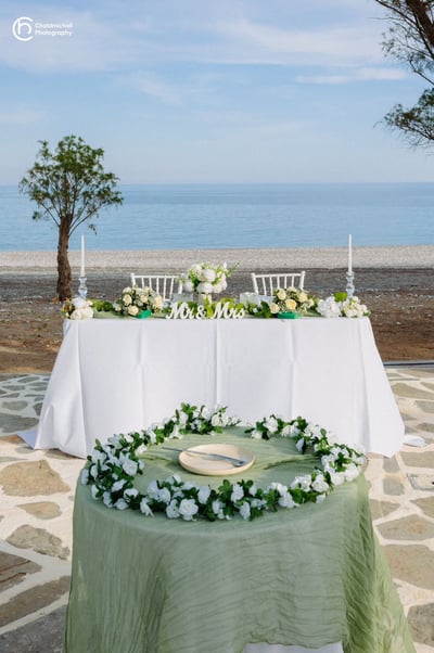 a wedding table with a wedding setting on beach