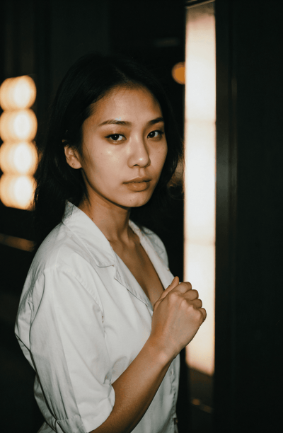 a woman in a white shirt and black pants