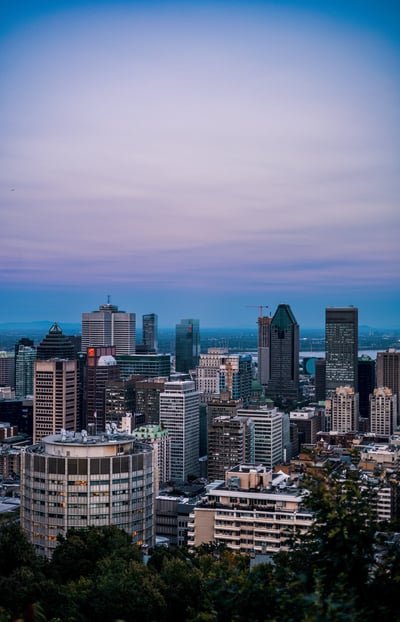 a city skyline with a blue sky and a few buildings, montreal photographer
