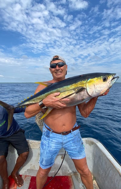 Anglers celebrating a successful yellowfin tuna catch in Makunduchi.