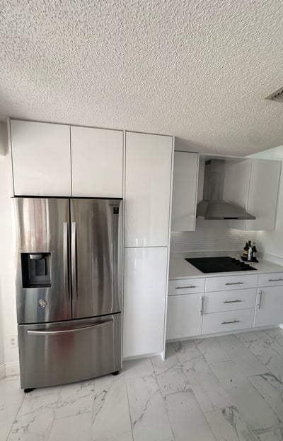 Complete kitchen renovation in Kissimmee featuring new cabinetry, tile flooring, and layout optimiza