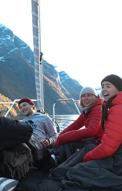 a group of people sitting on a boat