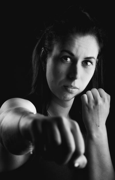 a woman in a black and white photo storytelling boxing