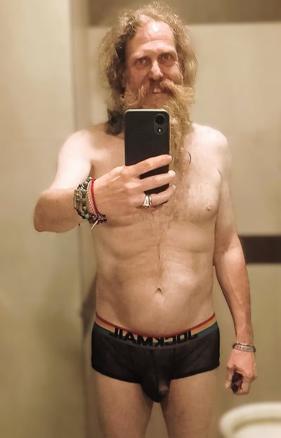 Axel TheBeast posing for a mirror selfie