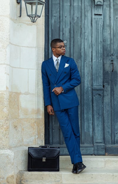 "classic men’s outfit with black briefcase"