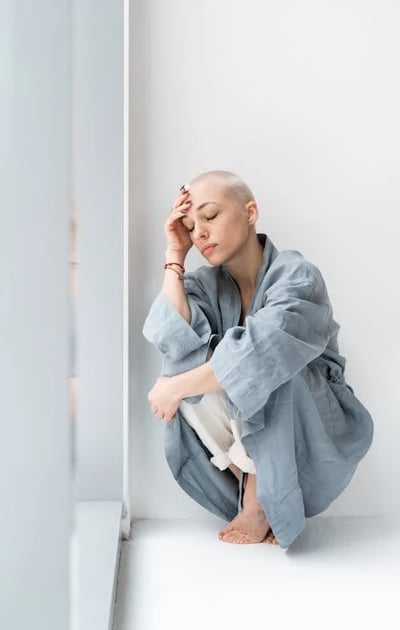 a woman with shaved hair and a shaved head and a shaved head