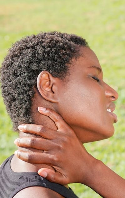 a woman with a black hair and a black top