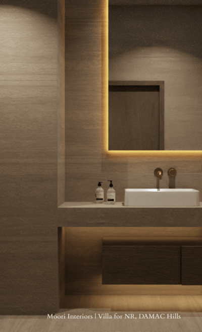 Bathroom mirror with integrated cove lighting, a white sink and dark wood vanity with underlighting