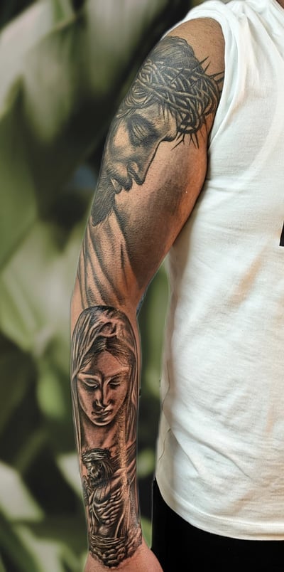 a man with a tattoo on his arm