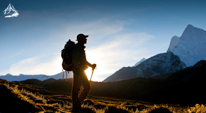 a man with a backpack on a mountain