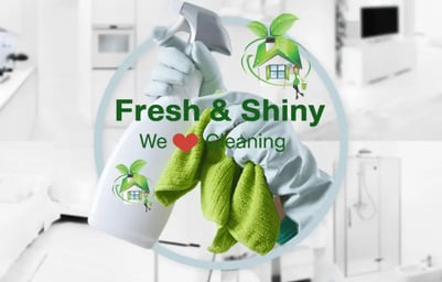 a person cleaning a kitchen with a cleaning cloth