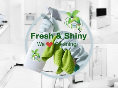 a person cleaning a kitchen with a cleaning cloth