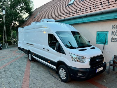 a van parked in front of a building