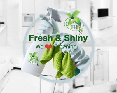 a person cleaning a kitchen with a cleaning cloth