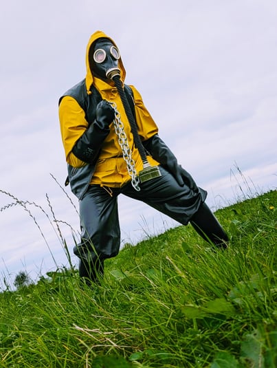 FTSH Studios model (s) Oscar Thickk UK Fetish Model wearing farmerrain bodysuit, raincoat, gloves, gas mask, chains