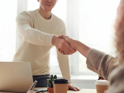 shaking hands in a meeting