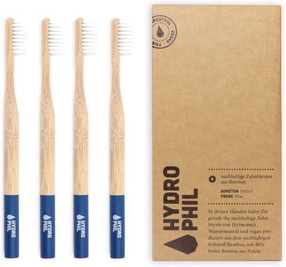 a set of three bamboo toothbrushes with a box of toothbrushes