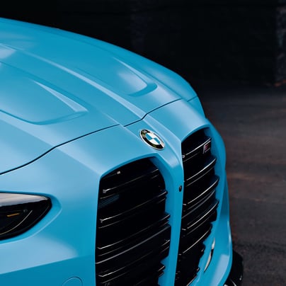 Electric blue BMW M3 Competition XDrive car photography at 704 Exotics in Charlotte, North Carolina.
