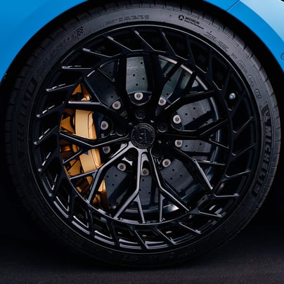 Electric blue BMW M3 Competition XDrive car photography at 704 Exotics in Charlotte, North Carolina.