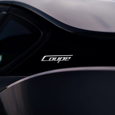 Sleek, black, and elegant BMW Coupe car photos taken at 704 Exotics in Charlotte, North Carolina.
