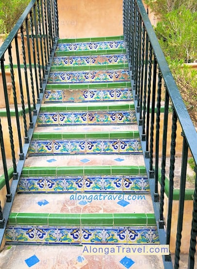 Bright green, blue & white tiles in patterns on a staircase are the finest example of Mudejar style