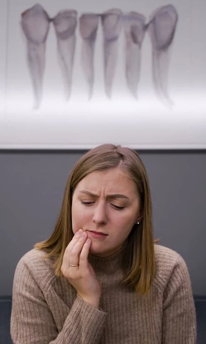 a woman with a toothbrush in her hand and a toothbrush in her hand