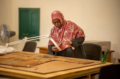 Sudanese woman restoring historical manuscripts