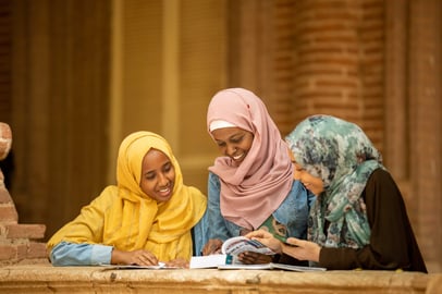 Sudanese girls studying together outdoors