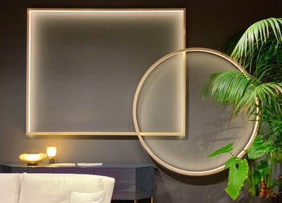 interior design elements on a wall showing accent lights with golden frames