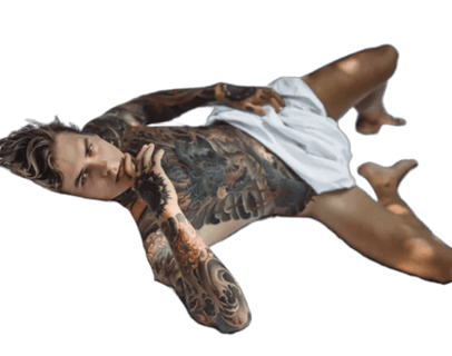 a man with tattoos on his chest and arms