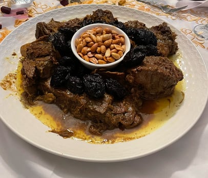 MOROCCO TOURS GASTRONOMY TOURS TEACHING SPECIAL DISHES INCULDING MEAT AND PRUNES AND ALMONDS TAJINE